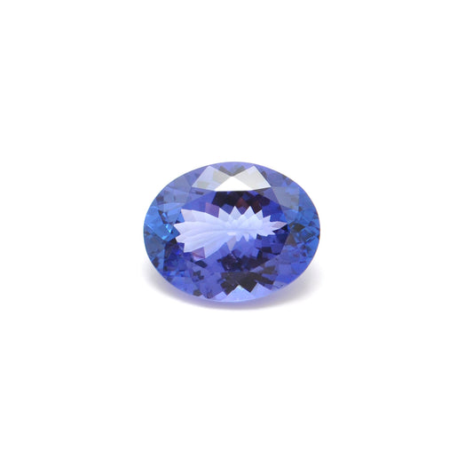 Close-up of a SAR Gems natural tanzanite gemstone, 7.65 carats, faceted oval cut, 11.5x14.5mm, showcasing violet-blue color and brilliant clarity.