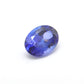 Close-up of a SAR Gems natural tanzanite gemstone, 6.25 carats, faceted oval cut, 6x10mm, showcasing violet-blue color and brilliant clarity