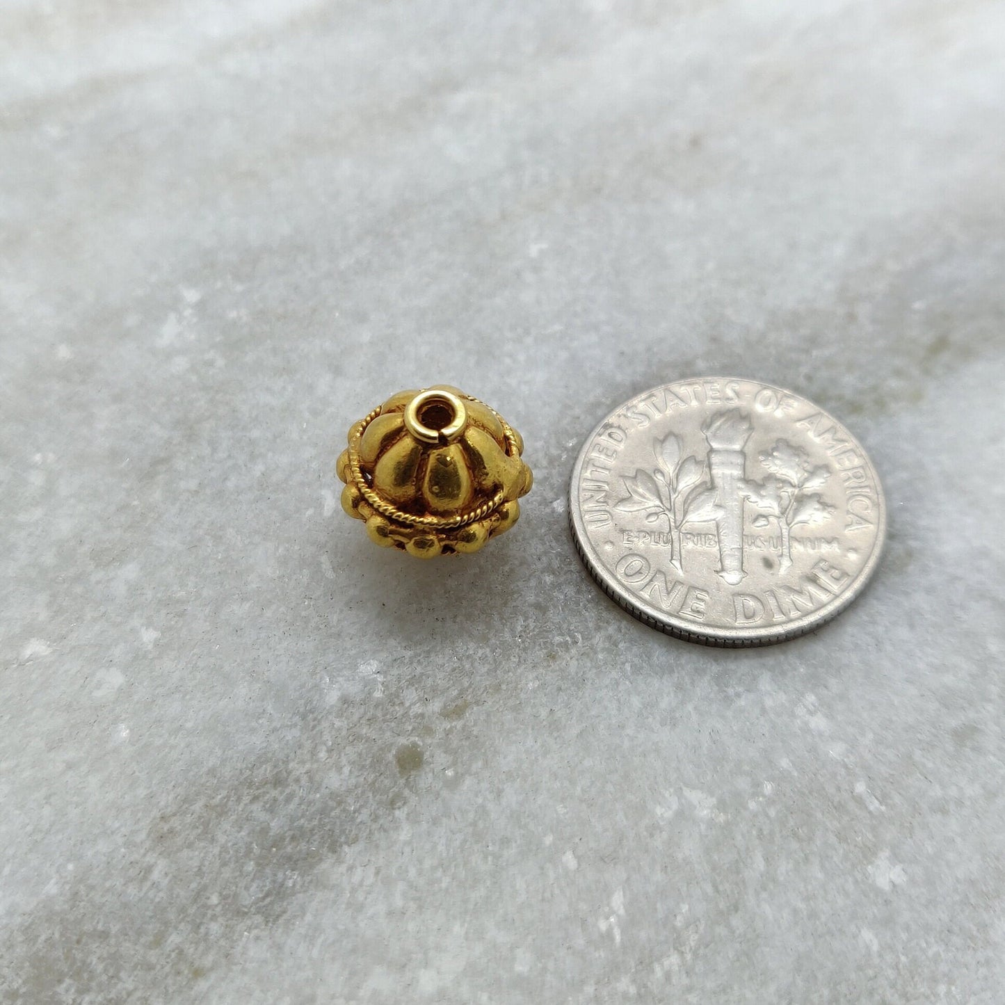 Solid 18K gold spacer ball bead used in luxury bracelet and necklace designs