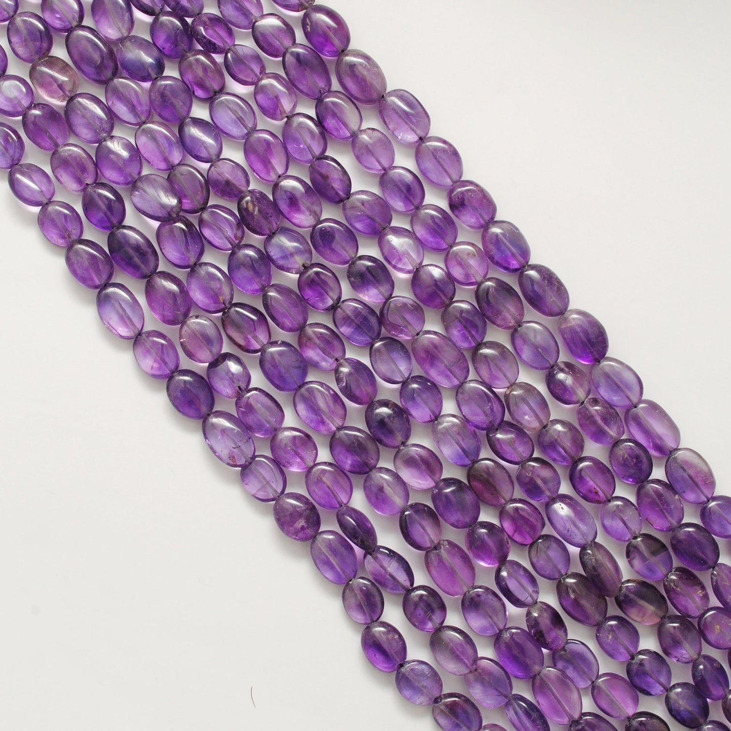 Natural Amethyst Oval Gemstone Beads – 5x10-9x13mm Mixed Sizes – 15" Strand (41 Stones)